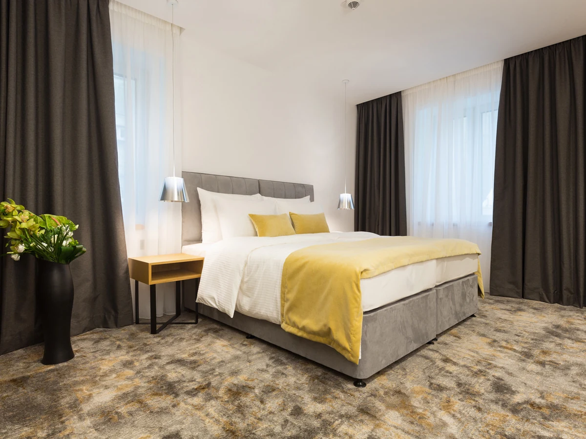 Bedroom painting in Cambridge by Cambridge Decorators, hotel-style bedroom with neutral tones