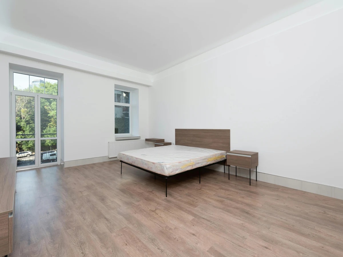 Minimalist white bedroom freshly painted by Cambridge Decorators