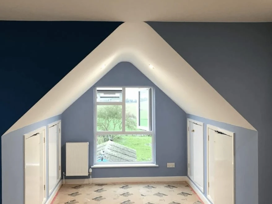 Bedroom painting in Cambridge — navy loft bedroom — Cambridge Decorators