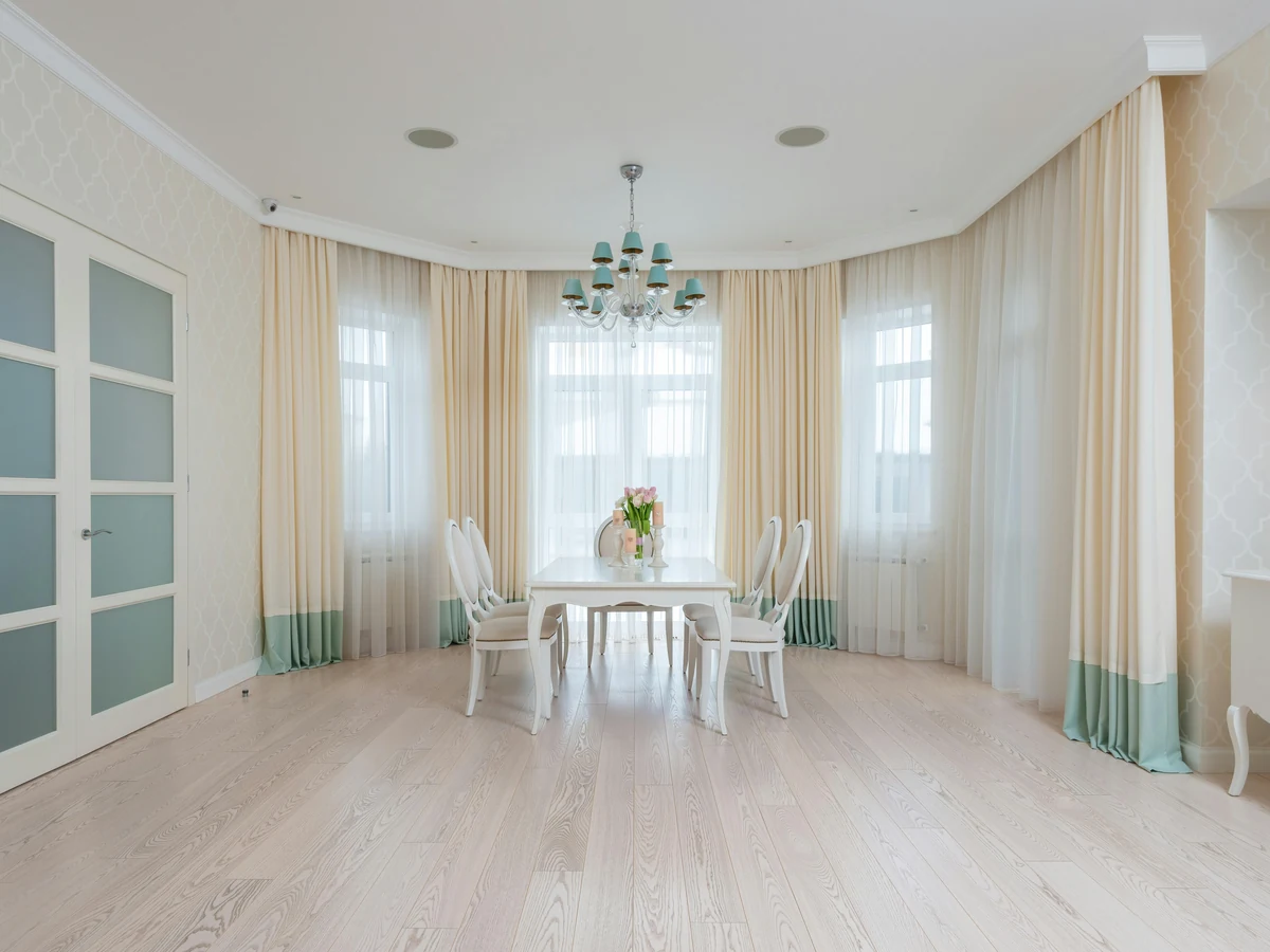 Elegant white dining room painting in Cambridge, period property decorated by Cambridge Decorators