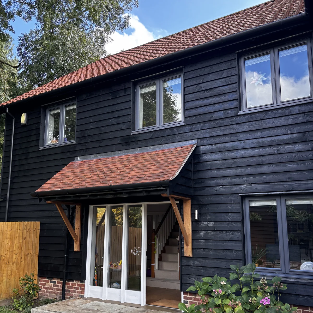 Repainted timber cladding and front entrance, Cambridge — Cambridge Decorators
