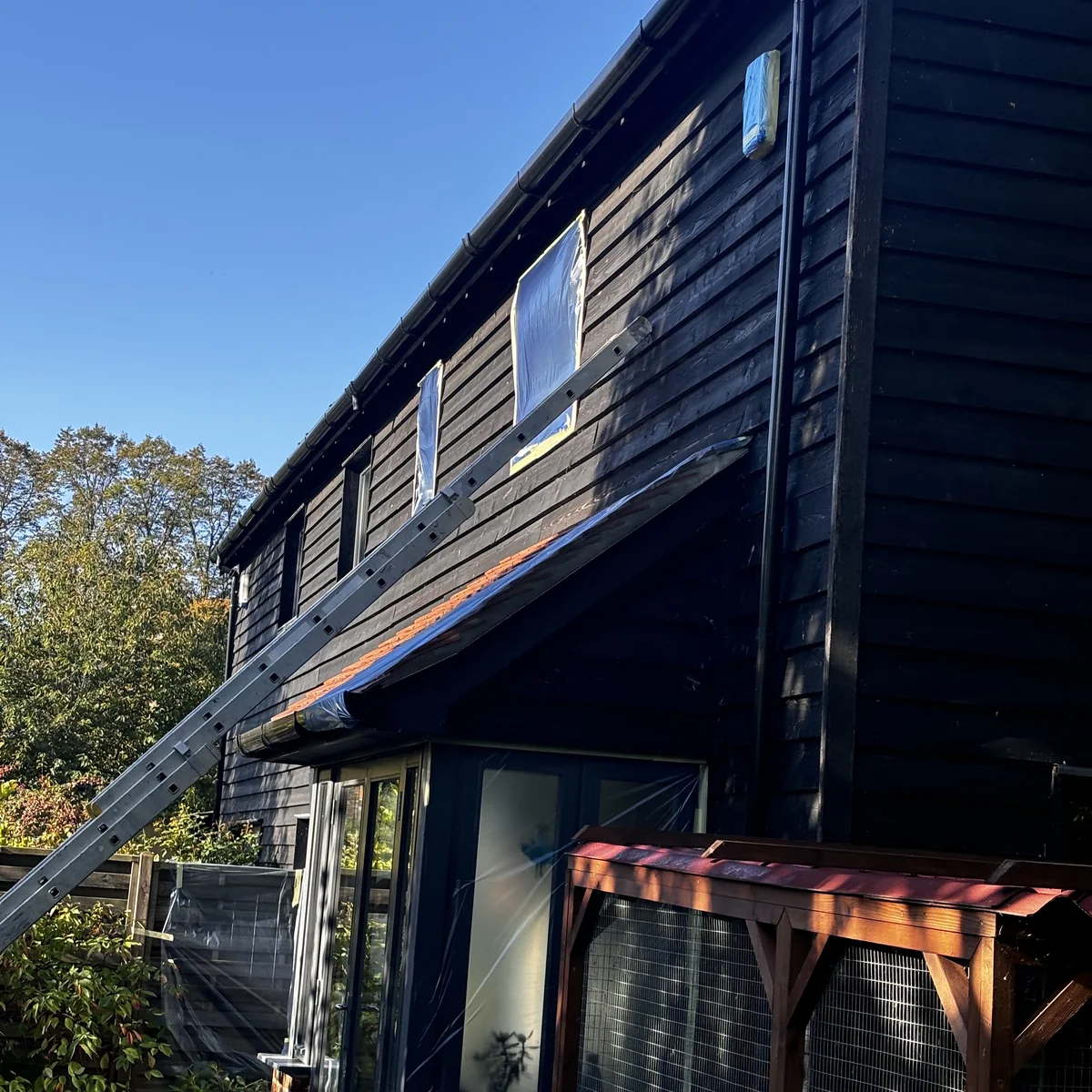 Timber cladding repaint in progress, Cambridge — Cambridge Decorators