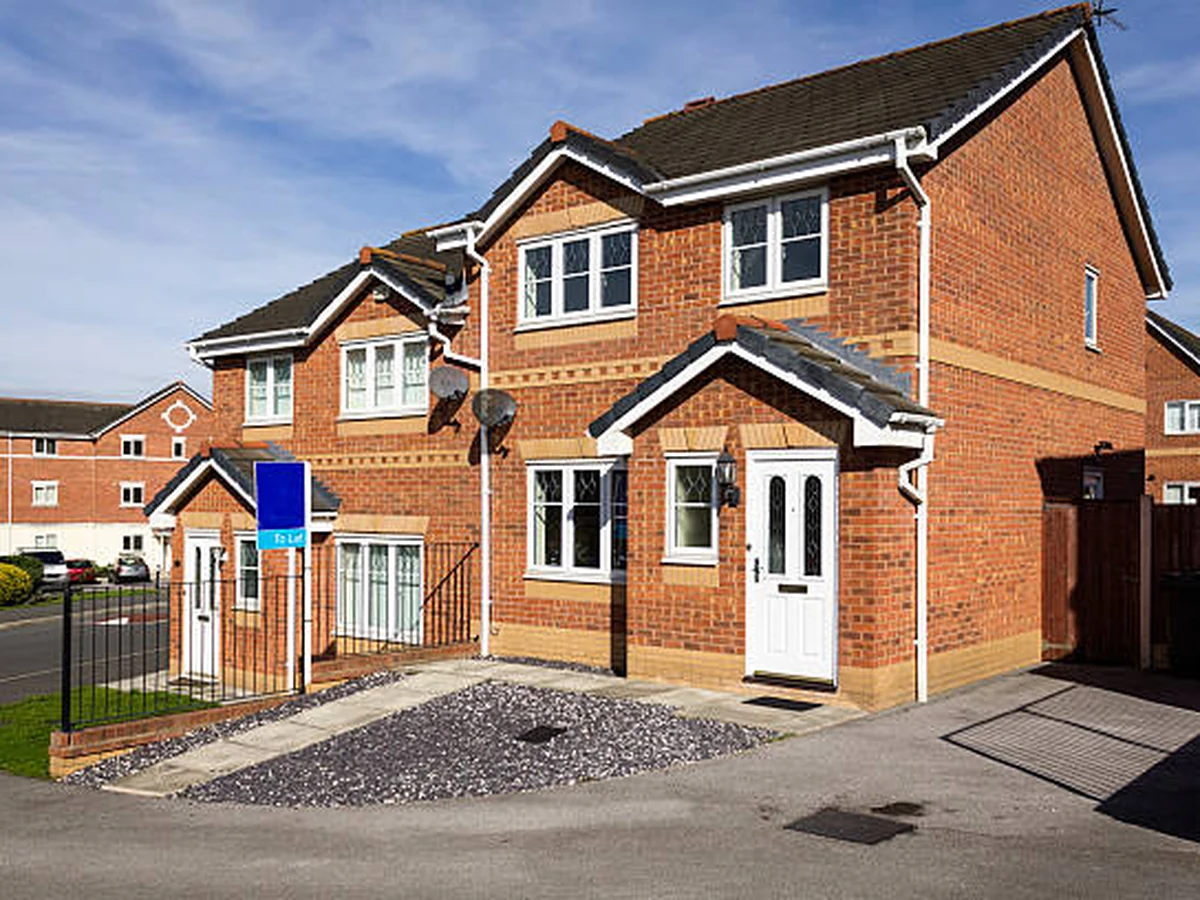 Exterior painting on red brick semi-detached property in Cambridge by Cambridge Decorators