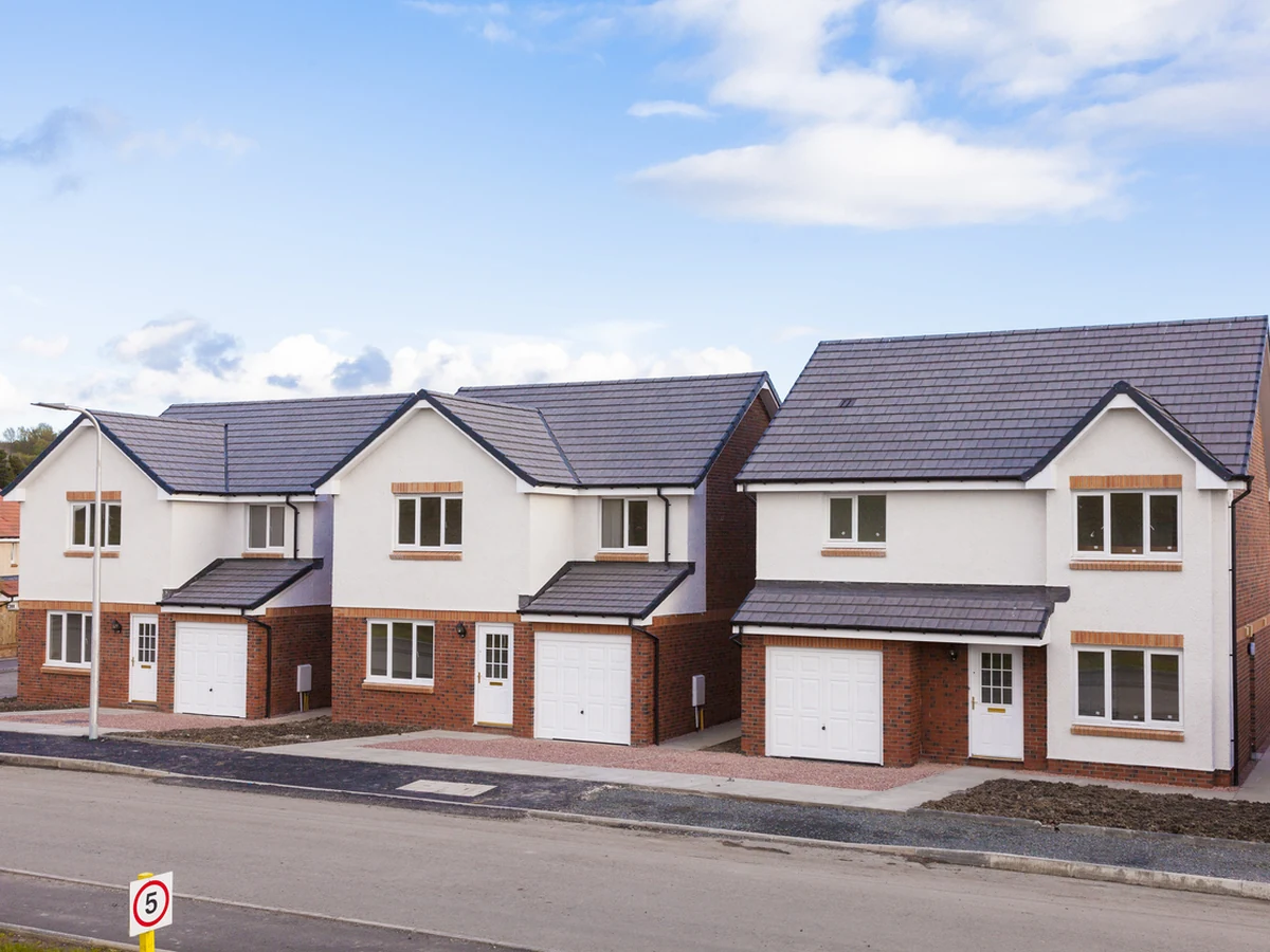 Exterior painting on a row of new detached homes in Cambridge by Cambridge Decorators