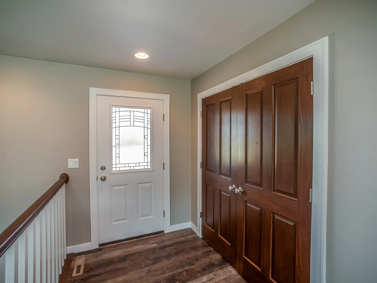 hallway-painting-entrance-hallway-white-cambridge-decorators White entrance hallway with painted doors by Cambridge Decorators