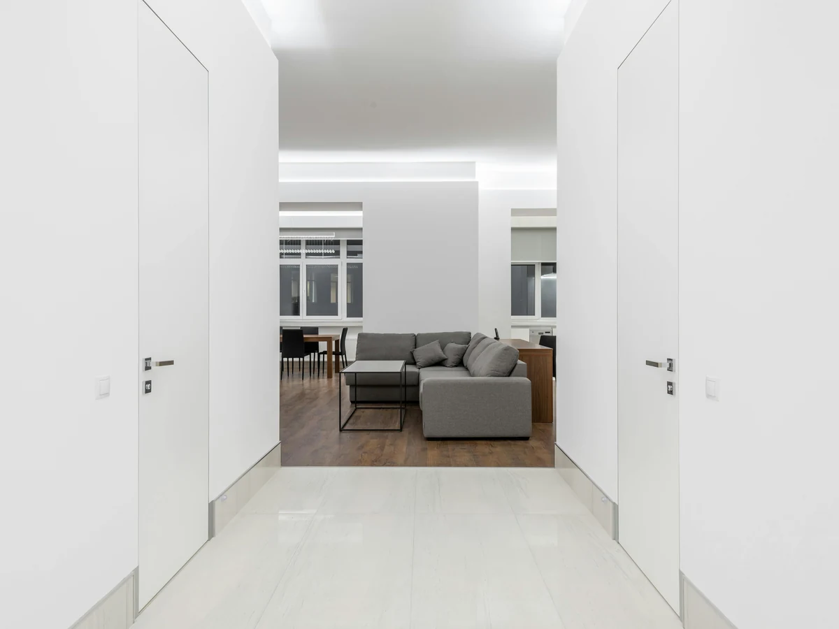 Minimalist white hallway painting in Cambridge by Cambridge Decorators