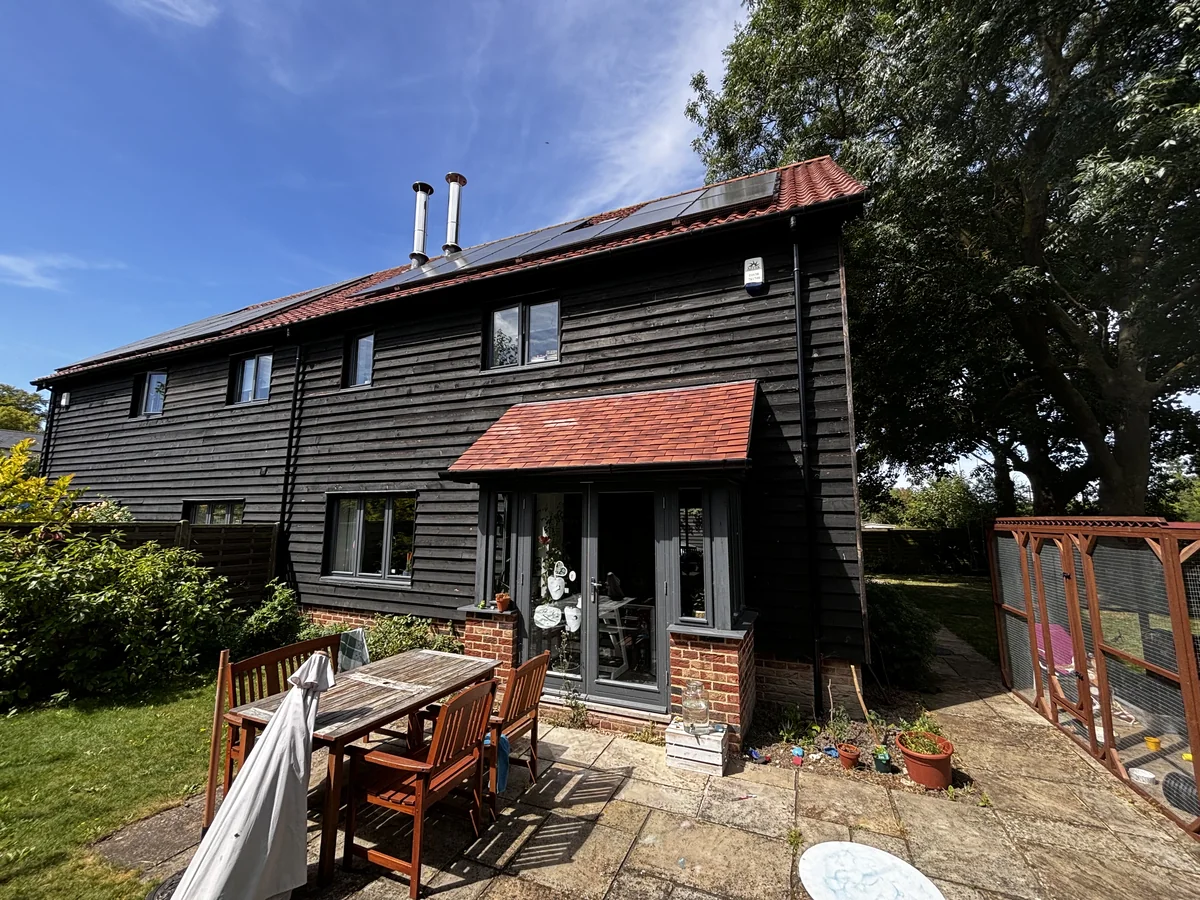 House painting in Cambridge — black weatherboard barn conversion, finished exterior — Cambridge Decorators