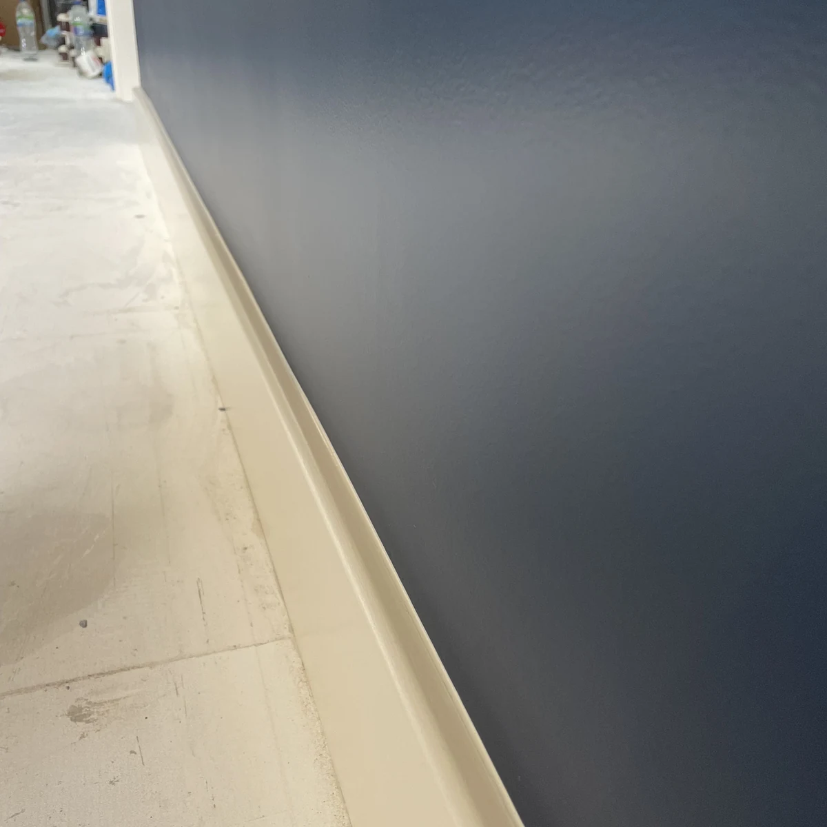 interior-painting-navy-wall-skirting-detail-cambridge-cambridge-decorators Interior painting in Cambridge — crisp navy wall and skirting detail — Cambridge Decorators