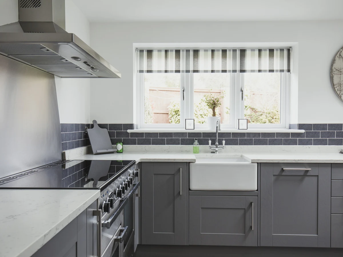 Contemporary grey shaker kitchen cabinets painted by Cambridge Decorators