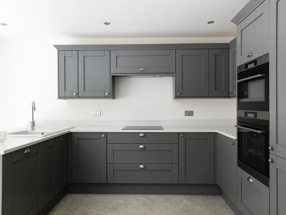 Sleek dark grey kitchen cabinet painting in Cambridge, high-spec finish by Cambridge Decorators