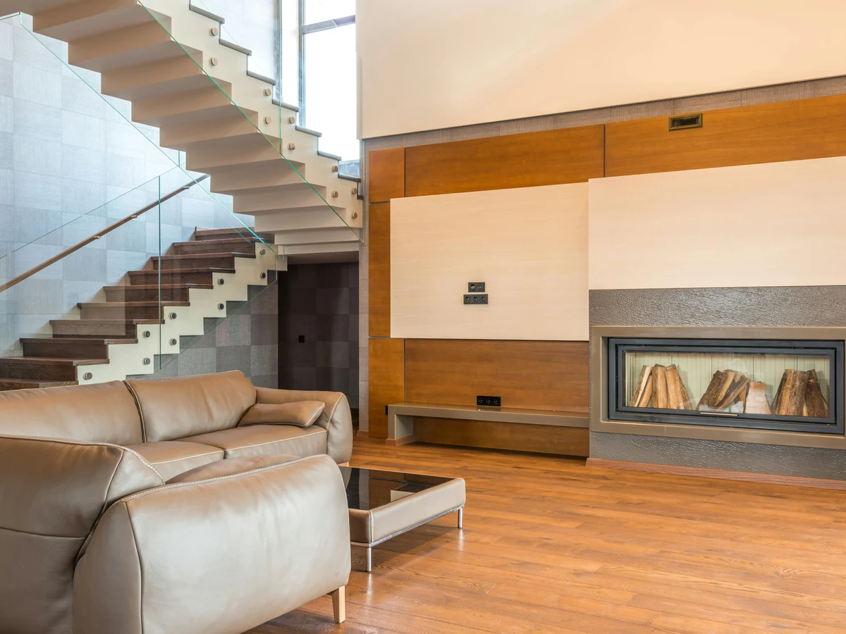 Luxury living room staircase painting in Cambridge by Cambridge Decorators