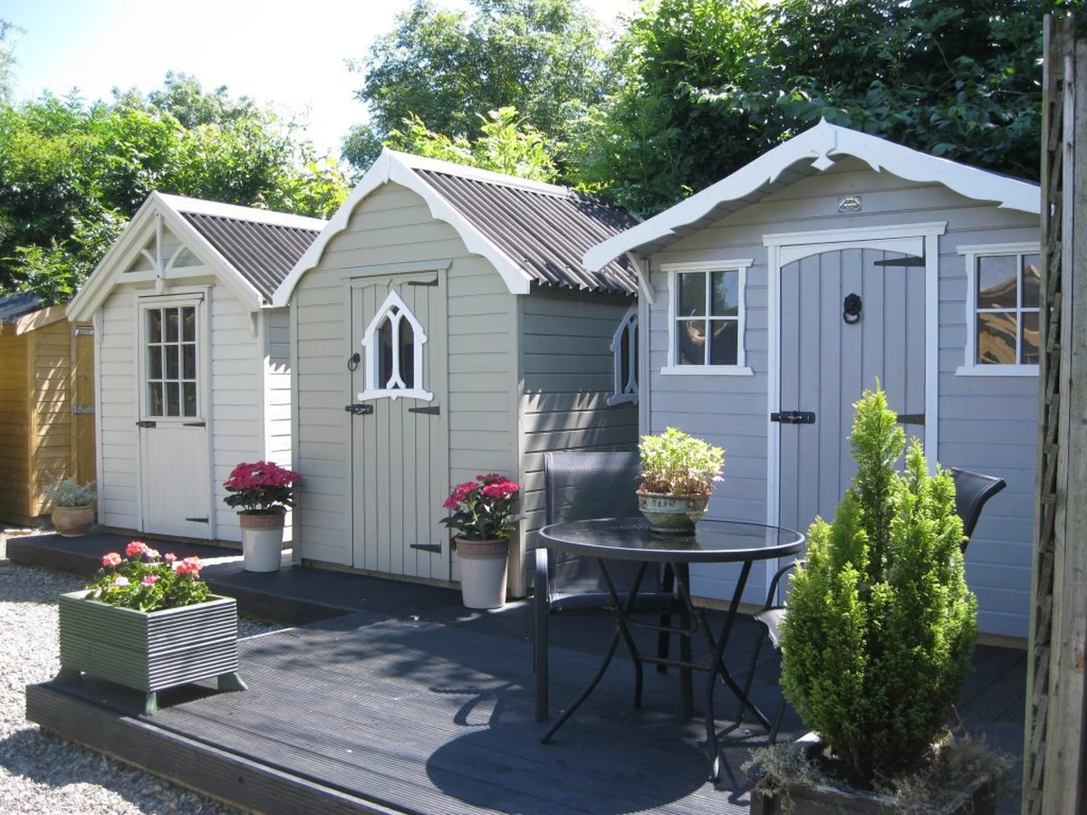 Shed painting in Cambridge by Cambridge Decorators, two freshly painted timber garden sheds